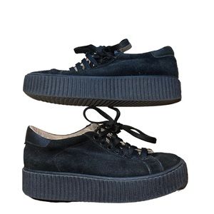 Platform black sneakers.